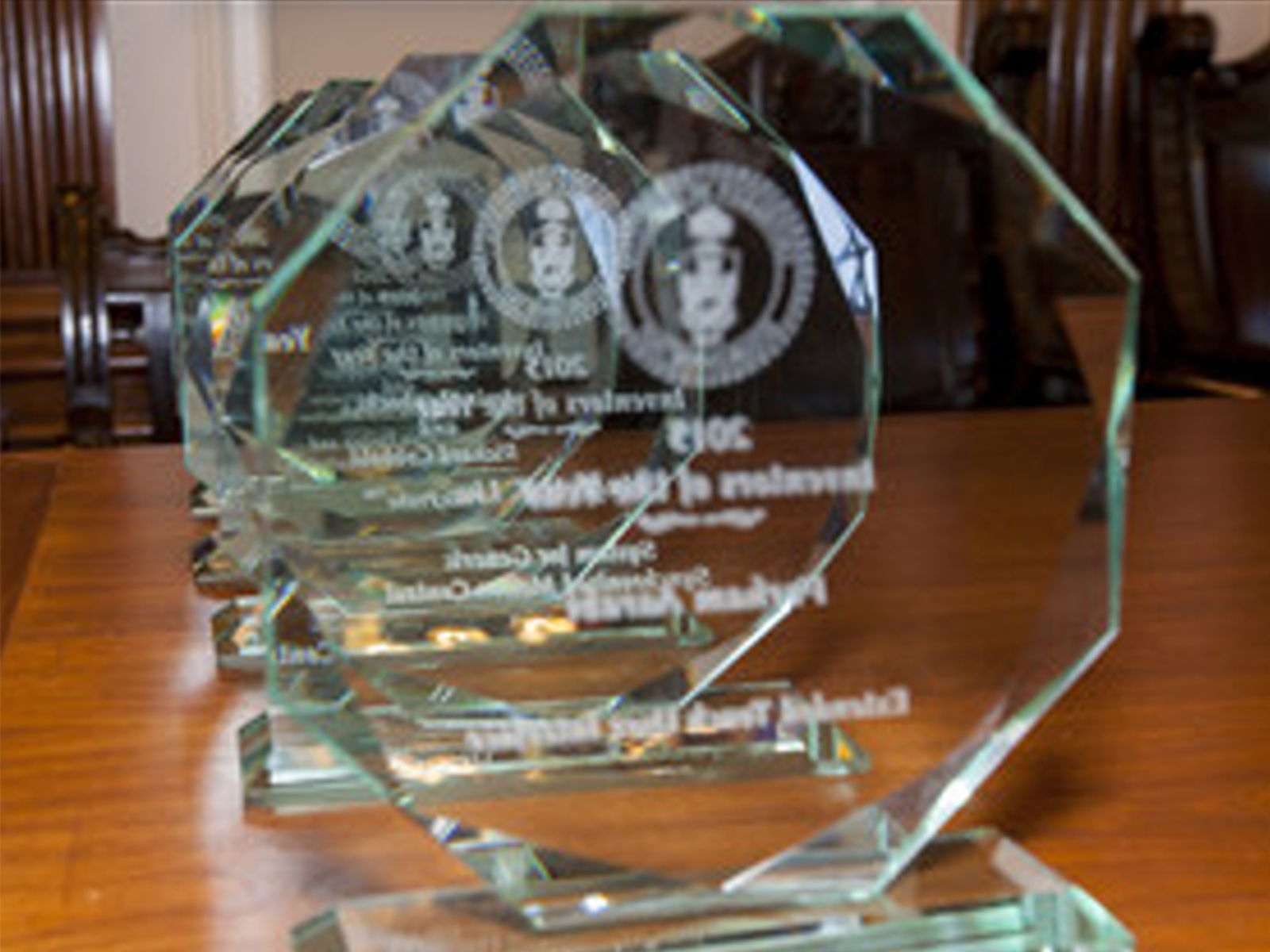 Award trophies displayed on a desk.